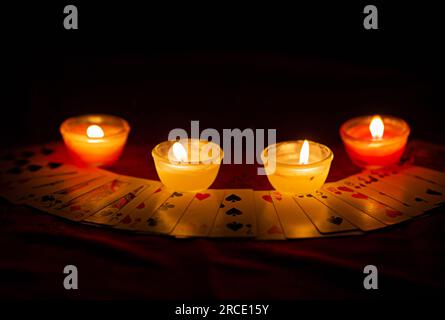 Candle lighting and divination with cards horoscope concept images Stock Photo