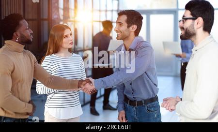 two businessmen shaking hands - welcome to business. replenishment of people in okmandu Stock Photo
