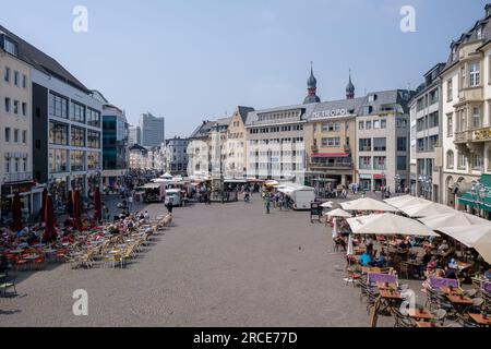 Bonn, Germany - May 22, 2023 : Panoramic view of the Market square in Bonn Germany with cafés, shops, restaurants and people enjoying the day Stock Photo