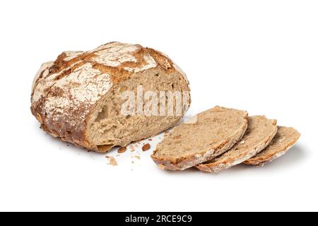 Fresh baked sourdough loaf of bread with pumpkin seeds and slices close up isolated on white background Stock Photo