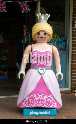 Giant Playmobil princess or queen model outside toy shop, Marlborough, Wiltshire, England, UK Stock Photo