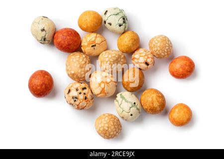 Heap of Japanese mixed coated peanuts close up isolated on white background Stock Photo