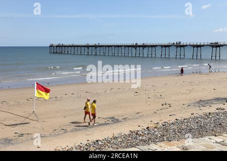 Saltburn Pier with RNLI Lifeguards Patrolling the Beach, Saltburn-by-the-Sea, North Yorkshire, UK Stock Photo