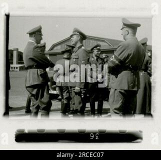 SS Photographer Domaschowitz  1943 Formal ceremony with photos of attending senior officers  Images depicting the front-line activities of Waffen-SS units . Stock Photo