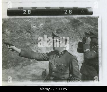 SS Photographer Feder 1943 & 1944 Remains of crashed aircraft, many individual soldier, officer, women personnel portrait, Belgian soldiers, Rexist , detailed photos of a resupply bomb, rocket launcher frame, barrack scenes, rifle and pistol marksmanship practice, families with children Images depicting the front-line activities of Waffen-SS units on the Western and Eastern Fronts, including Poland, France, Balkans, Italy, and Russia, as well as training exercises, portraits of individuals and group views, and scenes of cities and towns, and local populations. Stock Photo