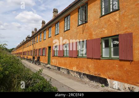 Characteristic yellow terraced houses in the historic district of Nyboder in Copenhagen Stock Photo