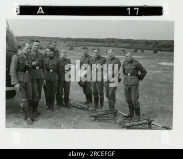 SS Photographer, Fink ,1943 & 1944 Funeral procession, Reinhard Heydrich, artist sculpting bust of Heydrich,  Heinrich Himmler, soldiers training with rocket launcher, ski troops training in mountains, bridging operation in mountains. Images depicting the front-line activities of Waffen-SS units on the Western and Eastern Fronts, including Poland, France, Balkans, Italy, and Russia, as well as training exercises, portraits of individuals and group views, and scenes of cities and towns, and local populations. Stock Photo