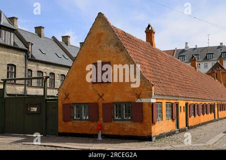 Characteristic yellow terraced houses in the historic district of Nyboder in Copenhagen Stock Photo