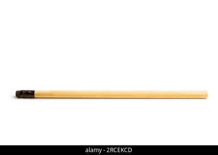 A black wooden pencil with eraser on a white background with copy space Stock Photo