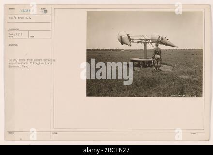 A 12-ft. horn-type sound detector is being tested at Ellington Field in Houston, Texas. The experimental device is used to analyze sound patterns. This photograph was received from Photographer 54316 in December 1918, and the description and details were issued with the photo under the classification CONFIDENTIAL EF 24 243. Stock Photo