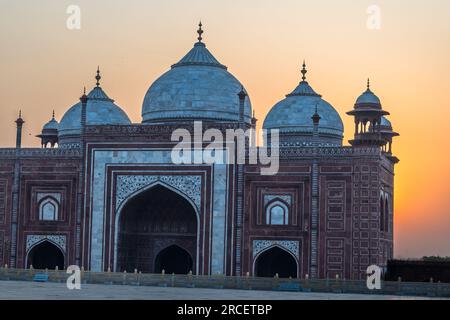 Morning photo of the Domes of Jama Masjid Mosqueas the sun is risingin the background. Stock Photo