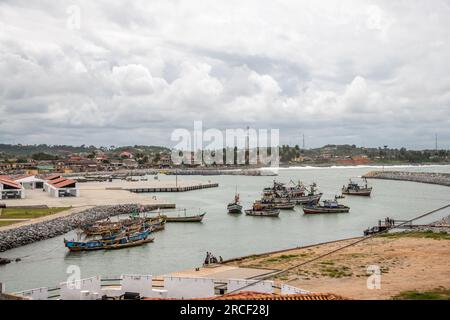 traditional wooden fishing boats in the harbor at Elmina, Ghana Stock Photo