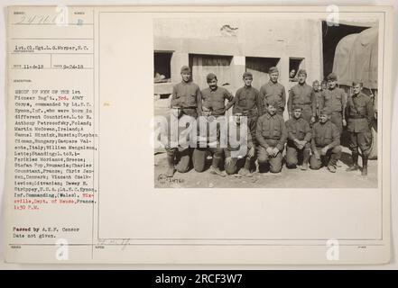 A group of men from the 1st Pioneer Regiment, 3rd Army Corps during World War I. The men in the photo were born in different countries, including Poland, Ireland, Russia, Hungary, Italy, Latvia, Greece, Romania, France, Denmark, Lithuania, and the USA. The commanding officer is Lt. E.C. Eynon from Wales. The photo was taken in Nixeville, Dept. of Meuse, France. Time of the photo is 1:30 PM. This image was passed by the A.E.F. Censor, but the specific date is not provided. (Source: Photographs of American Military Activities during World War I, Record Group 111-SC, National Archives) Stock Photo