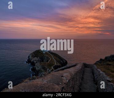 The head of the 400 steps down to South Stack Lighthouse at sunset Stock Photo