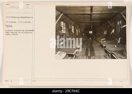 This image shows the sleeping quarters of detachment Camp Hospital No. 50 in Tonnerre, Yonne, France. The photograph was taken on April 14, 1919, by GT. A. L. Villanova from the S.C. RECO unit. The photo bears the annotation 2364-89, and the description specifies the location and purpose of the building. Stock Photo