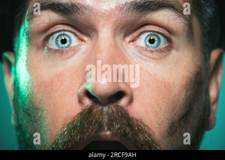 Closeup portrait of industrial worker in in safety helmet. Amazed builder, engineer, repairman in protective helmet. Construction, industry and mining Stock Photo