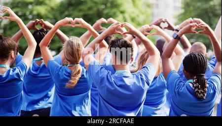 Diverse Young Charity Group Making Hearts Using Hands Stock Photo