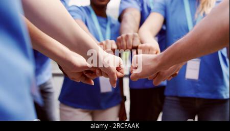Volunteer Charity Team Joining Hands Together. Teamwork Concept Stock Photo