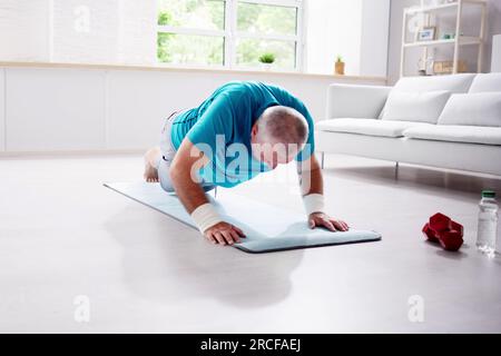 Funny Home Fitness Workout. Man Doing Sport Stock Photo