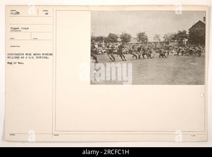 Wounded soldiers at a U.S. hospital engage in a tug of war activity as part of their restoration work. The photograph, taken by a Signal Corps photographer, captures the rehabilitation efforts. The date on the photograph is noted as 1945. Stock Photo