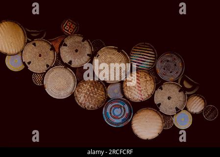 Uteo is Swahili for “winnowing tray.” It is used to separate the chaff from grain by carefully throwing the grain in the direction of the wind in orde Stock Photo