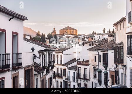 Views of the medieval village of Ronda with white Andalusian houses and the gothic style church of Santuario de Mar a Auxiliadora. Malaga, Spain Stock Photo