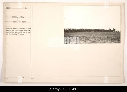 Cavalry troops riding their horses during a review by President Woodrow Wilson of the 26th division in Chaumont, France. The photo was taken in 1918 by the Signal Corps and is marked with the number 63498. It is described as cavalry participating in the review. Note that there is an additional identification number of 9008498. Stock Photo