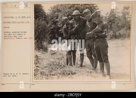 American soldier providing his name and identification number to an ambulance attendant near Montreuial, France on June 7, 1918, during World War One. This photograph, taken by Sgt. A. C. Duff, was released by the A. E. F. Censor on June 24, 1918. Stock Photo