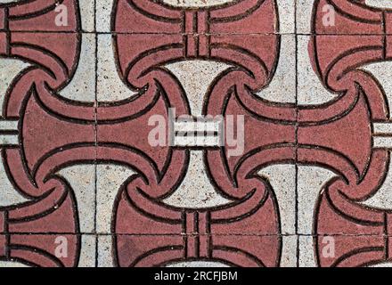 Red and white textured concrete blocks on floor Stock Photo
