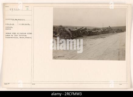 Image showing German guns of various sizes captured by the 79th Division in Vacherauville, Meuse, France. The photograph was taken on December 14, 1918, by photographer M. Pox, S.C. with the reference number 49322. The guns are seen lined up in the foreground, representing the spoils of war. Stock Photo