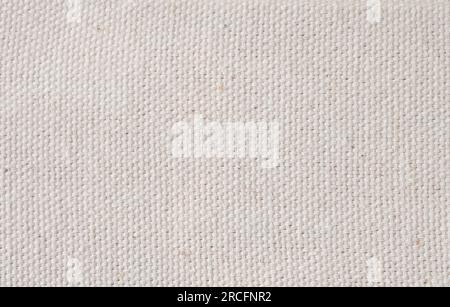 Textured background of an interwoven beige fabric. panoramic web banner Stock Photo
