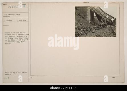 This photograph depicts the aftermath of the Germans blowing out a bridge during their retreat from Vaux Andigny, Aisne on October 17, 1918. The bridge, located in the district of Souplet and Vaux-Andigny, Aisne, France, was heavily damaged as shown in the image. The photograph was released by the A.E.P. Censor and is dated January 7, 1919. Stock Photo