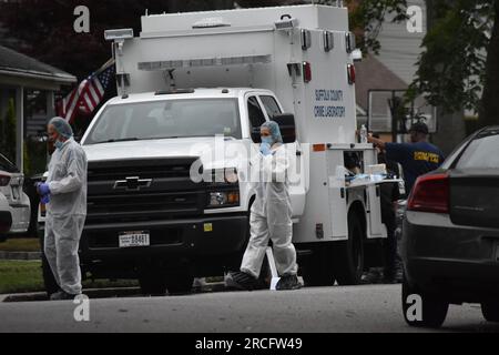 United States. 14th July, 2023. Numerous investigators at the crime scene. Crime scene investigators on scene as a suspect is arrested in Gilgo Beach serial killings In Massapequa Park, Long Island, New York on July 14, 2023. Massive police presence on First Avenue and Michigan Avenue as police apprehend the suspect involved in the Gilgo Beach serial killings. (Photo by Kyle Mazza/SOPA Images/Sipa USA) Credit: Sipa USA/Alamy Live News Stock Photo