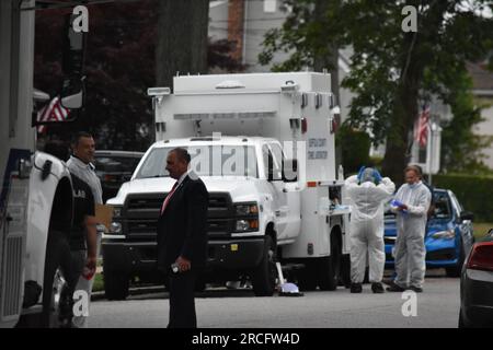 United States. 14th July, 2023. Numerous investigators at the crime scene. Crime scene investigators on scene as a suspect is arrested in Gilgo Beach serial killings In Massapequa Park, Long Island, New York on July 14, 2023. Massive police presence on First Avenue and Michigan Avenue as police apprehend the suspect involved in the Gilgo Beach serial killings. (Photo by Kyle Mazza/SOPA Images/Sipa USA) Credit: Sipa USA/Alamy Live News Stock Photo