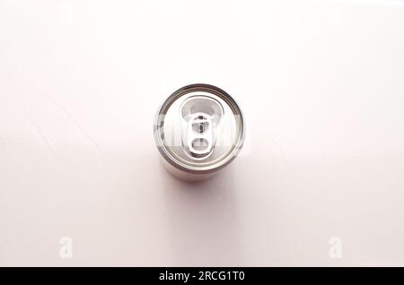 Closeup of unmarked empty soda can, top view.000- Metallic surface without marks or distinctive signs. Stock Photo