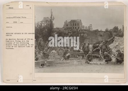 American Battery of 155 mm. Howitzers firing on retreating German columns from a position in the captured town of Varennes. The image captures the American advance in the Argonne region during World War I. The photograph, numbered 23033, was taken in 1919 and is an official photo. Stock Photo