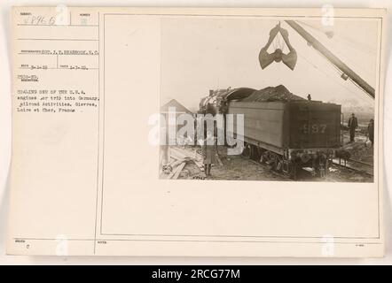 American soldiers coal one of their engines in preparation for a trip into Germany during World War One. This photograph was taken in Gievres, Loire et Cher, France by photographer SOT. J.T. Seabrook. The image is numbered 48965 and was captured on January 7, 1919. Written on the back are the notes 'Med 31-19 2509-19' and 'Coal TAKEN: 1-7-19+' Stock Photo