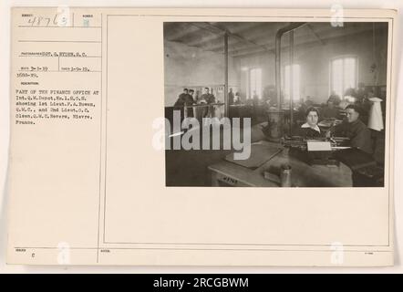 'Factual caption: Photograph taken on January 9, 1919, by Sgt. G. Ryden, S.C., of Part of the Finance Office at Int. Q.M. Depot, No.1, S.O.S. The image shows 1st Lt. F. A. Bowen, Q.M.C. and 2nd Lt. O. C. Olsen, Q.M.C. in Nevers, Nievre, France. The photograph is numbered 54487631 PROTOGRAPHER SGT. G. RYDEN.S.C. NUMBER RECO 3-1-19 TAKEN 1-9-19. 1688-19. DESCRIPTION: PART OF THE FINANCE OFFICE AT Int.Q.M. Depot, No. 1.8.0.8. showing 1st Lieut. P. A. Bowen, Q.M.C., and 2nd Lieut.O.C. Olsen, Q.M.C. Nevers, Nievre, France. ISSUED C NOTES: 48763 3-400.' Stock Photo