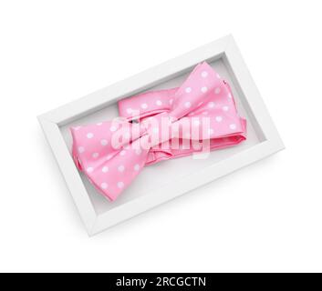 Stylish pink bow tie with polka dot pattern on white background, top view Stock Photo