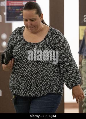 New York, USA. 14th July 2023.  RIVERHEAD, NEW YORK - JULY 14: Woman believed to be the wife of Rex Hauermann walks inside the The Suffolk County Court in, Riverhead, New York. Rex Hauermann is the suspect arrested in the unsolved Gilgo Beach killings in the unsolved case tied to at least 10 sets of human remains that were discovered since 2010 in suburban Long Island. The suspect Rex Heuermann is expected to be arraigned after his arrest Thursday night. A grand jury charged Heurmann with six counts of murder. Credit: Storms Media Group/Alamy Live News Stock Photo