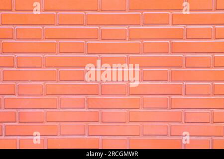 Pale red glazed brick surface, empy space for backgrounds or backdrops. Stock Photo