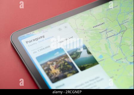 New York, USA - July 6, 2023: Population and area of Paraguay country on map ipad macro close up view Stock Photo