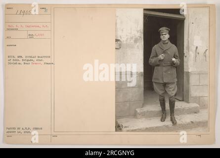 Cpl. R.H. Ingleston of the Signal Corps is pictured with Brig. Gen. Douglas MacArthur of the 84th Brigade, 42nd Division. The photograph was taken near Bremes, France on August 4, 1918. It was passed by the A.E.F. censor on August 14, 1918, and issued under the notes of du Nel 13905. Stock Photo