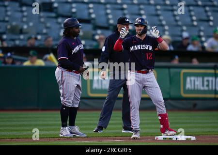 Minnesota Twins' Kyle Farmer (12) tosses his bat after striking