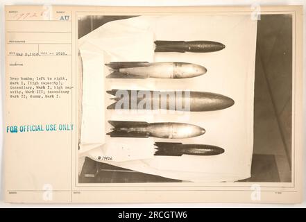 Factual Caption: 'Photograph taken on May 2, 1918, showing various types of bombs used during World War One. From left to right: Mark I (high capacity), incendiary Mark I, high capacity Mark III, incendiary Mark II, and dummy Mark I. This image was issued for official use only.' Stock Photo