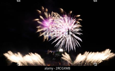Paris, France. 14th July, 2023. Fireworks explode near the Eiffel Tower during the Bastille Day celebrations in Paris, France, July 14, 2023. France held the celebrations of the French National Day, or Bastille Day, on Friday. Credit: Gao Jing/Xinhua/Alamy Live News Stock Photo