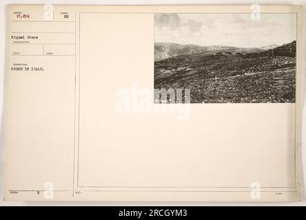 American soldiers stationed in Italy during World War One. The photograph captures a scene, with soldiers in military uniforms and military vehicles in the background. The exact details of the scene are not provided in the description. The photograph was taken by Signal Corps photographer and assigned the identification number 111-SC-15294. Stock Photo