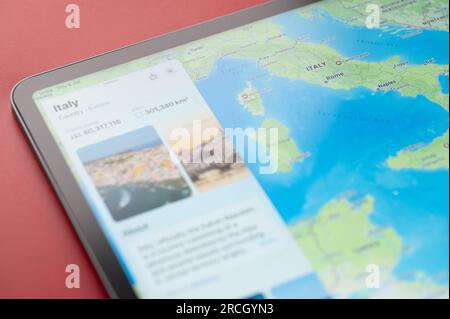 New York, USA - July 6, 2023: Italy country info on apple maps ipad macro close up view Stock Photo