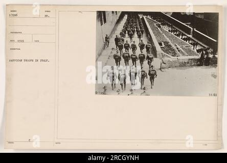 American troops in Italy during World War One, seen wearing gas masks. The soldiers are preparing for potential gas attacks while stationed in the field. This photograph was taken in 1919. Stock Photo