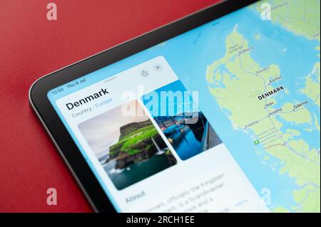 New York, USA - July 6, 2023: Denmark on online apple maps in screen of ipad tablet close up view Stock Photo